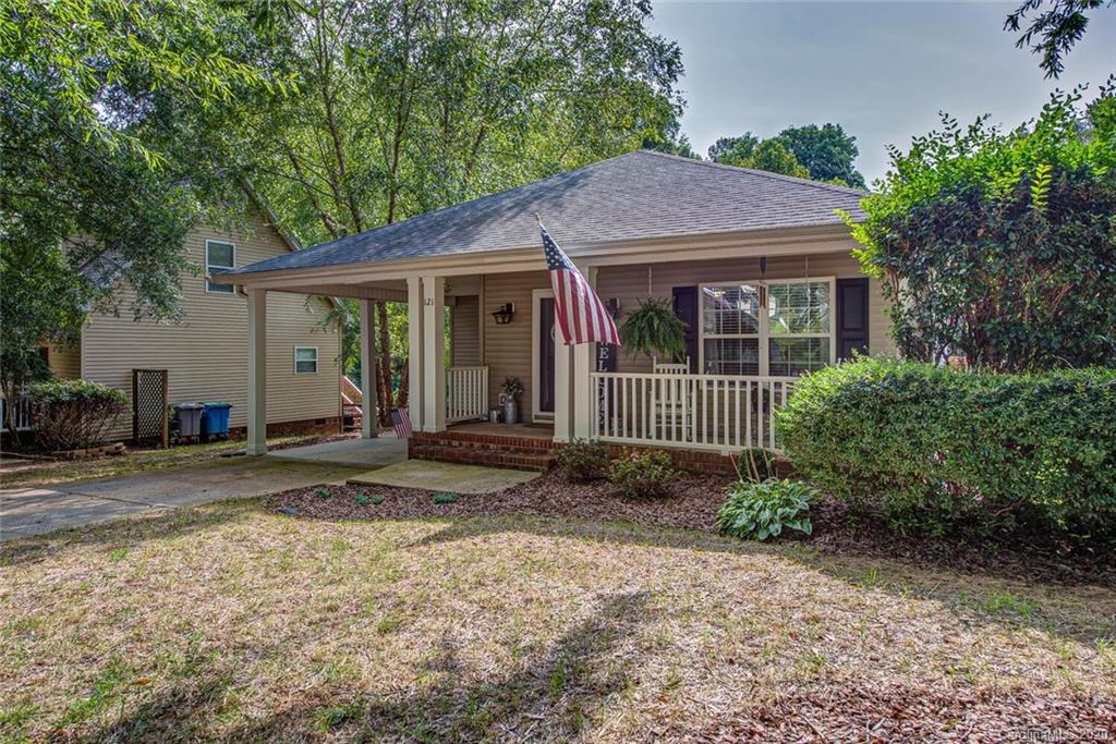 121 Pratt Street Belmont, NC 28012 - Photo 2 of 29 a view of a house with a yard plants and large tree
