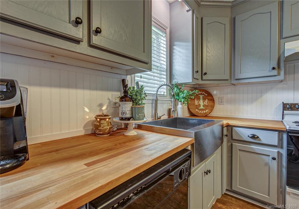 121 Pratt Street Belmont, NC 28012 - Photo 14 of 29 a kitchen with a sink and cabinets
