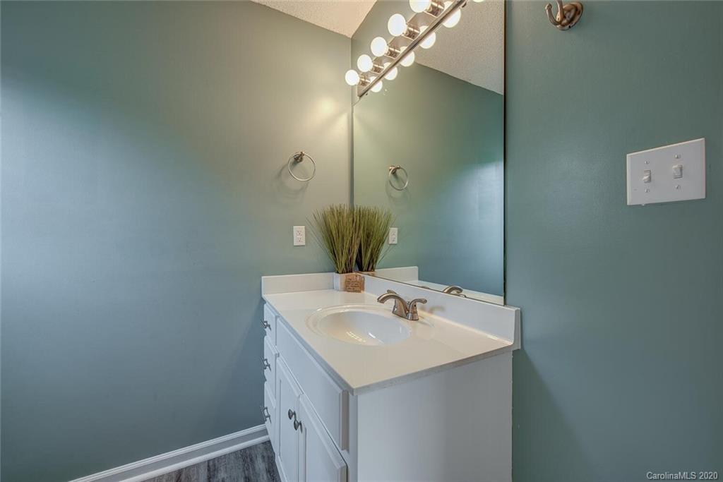 121 Pratt Street Belmont, NC 28012 - Photo 20 of 29 a bathroom with a sink and a mirror