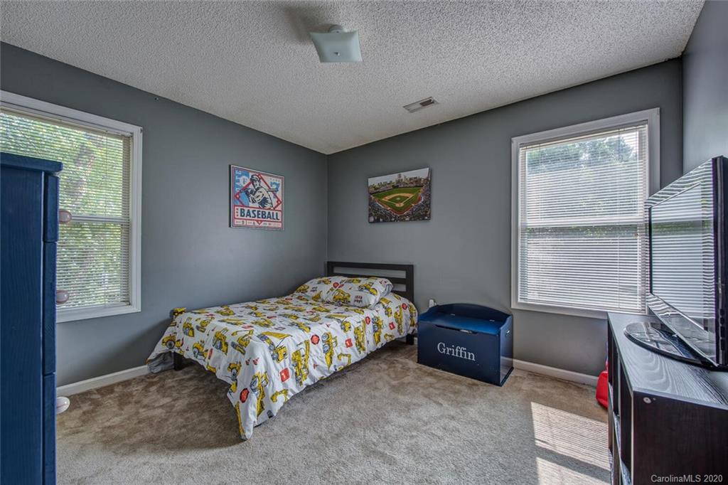 121 Pratt Street Belmont, NC 28012 - Photo 21 of 29 a bedroom with a bed and a window