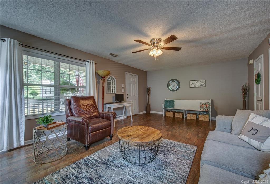 121 Pratt Street Belmont, NC 28012 - Photo 10 of 29 a living room with furniture a table and a large window