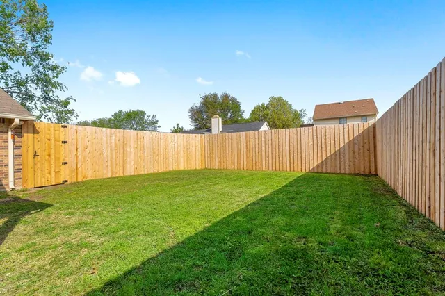 a view of a backyard with green space