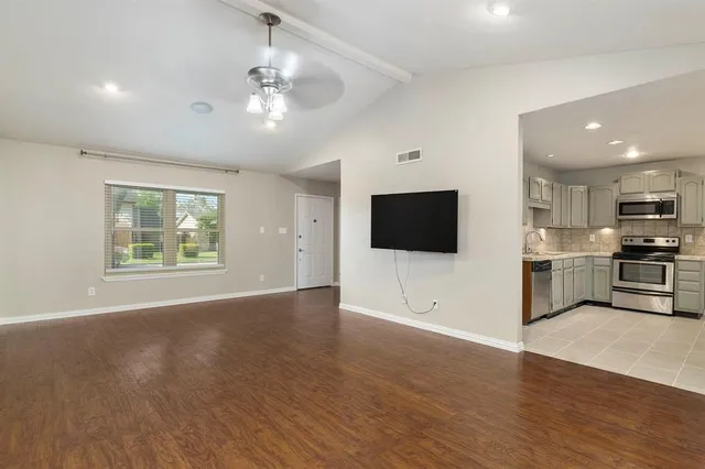 a view of kitchen with microwave and stove