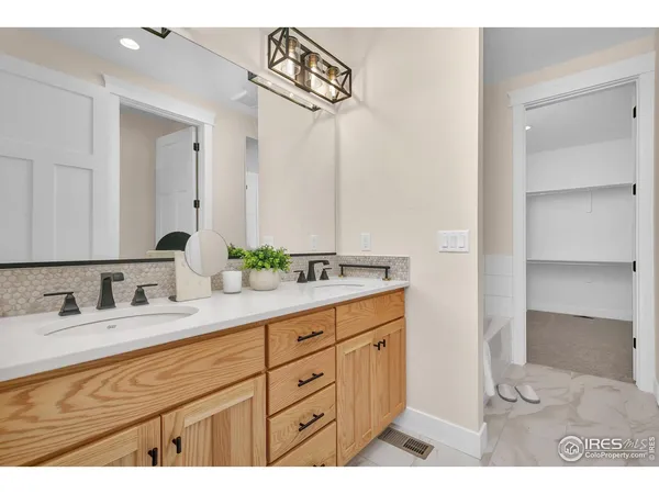 a view of an empty room and wooden floor