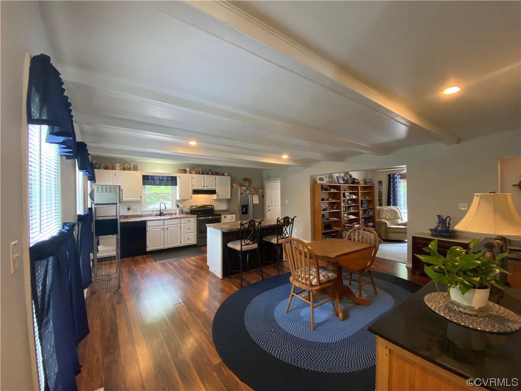 19535 Templeton Road Carson, VA 23830 - Photo 4 of 10 a living room with furniture and a dining table with kitchen view