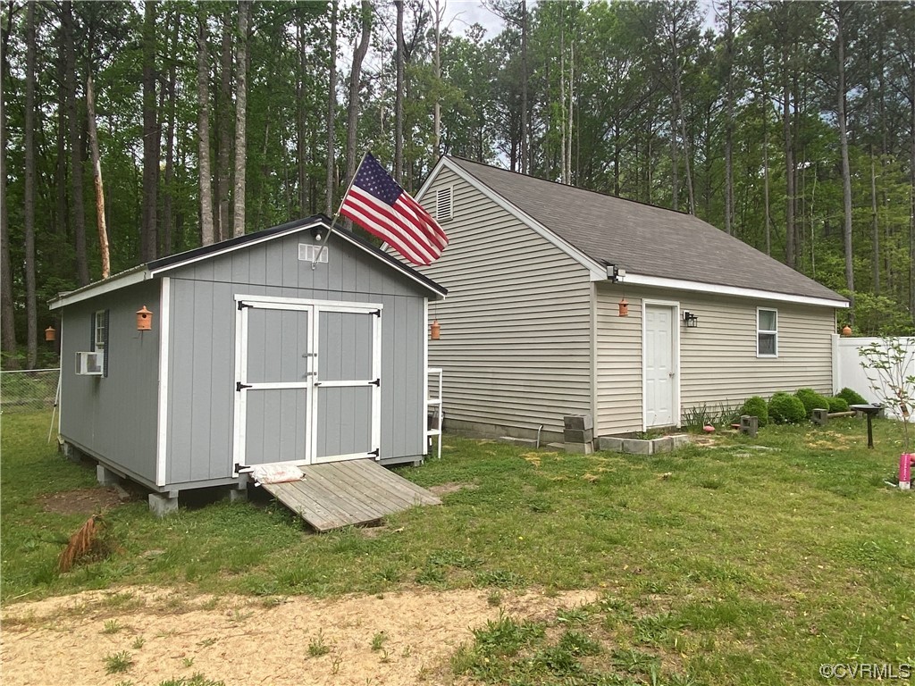 19535 Templeton Road Carson, VA 23830 - Photo 10 of 10 a house that has a backyard