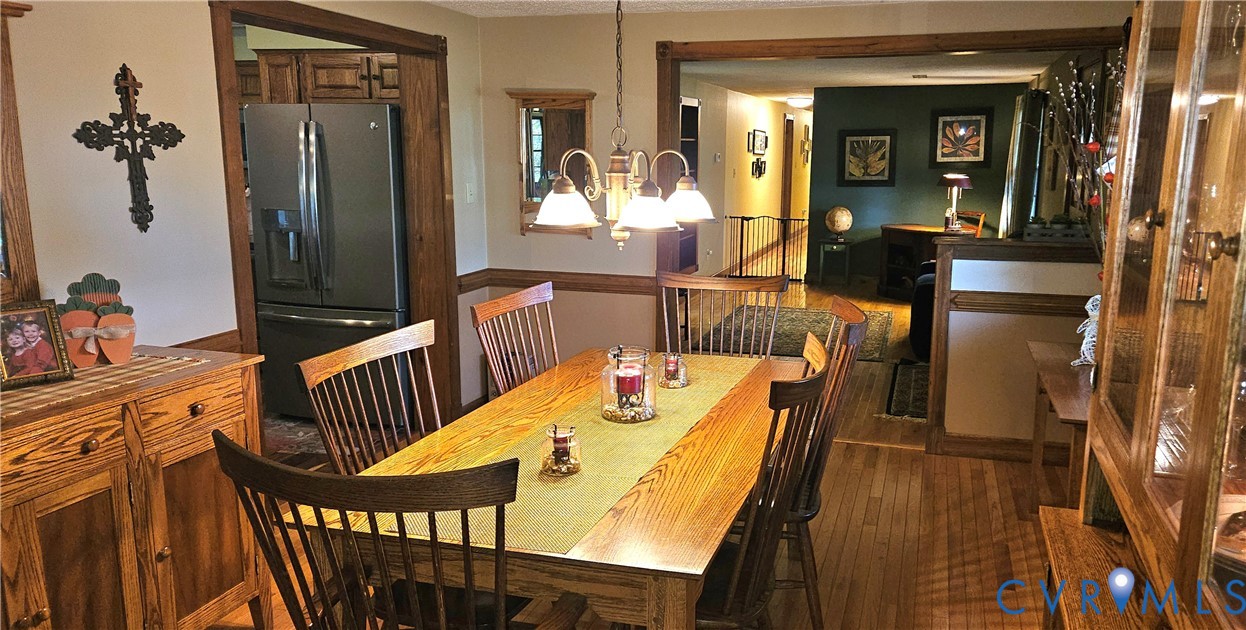 10511 Ashcake Road Ashland, VA 23005 - Photo 15 of 58 a view of a dining room with furniture window and wooden floor