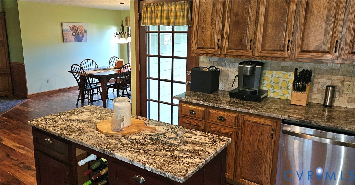 10511 Ashcake Road Ashland, VA 23005 - Photo 22 of 58 a kitchen with granite countertop cabinets and window