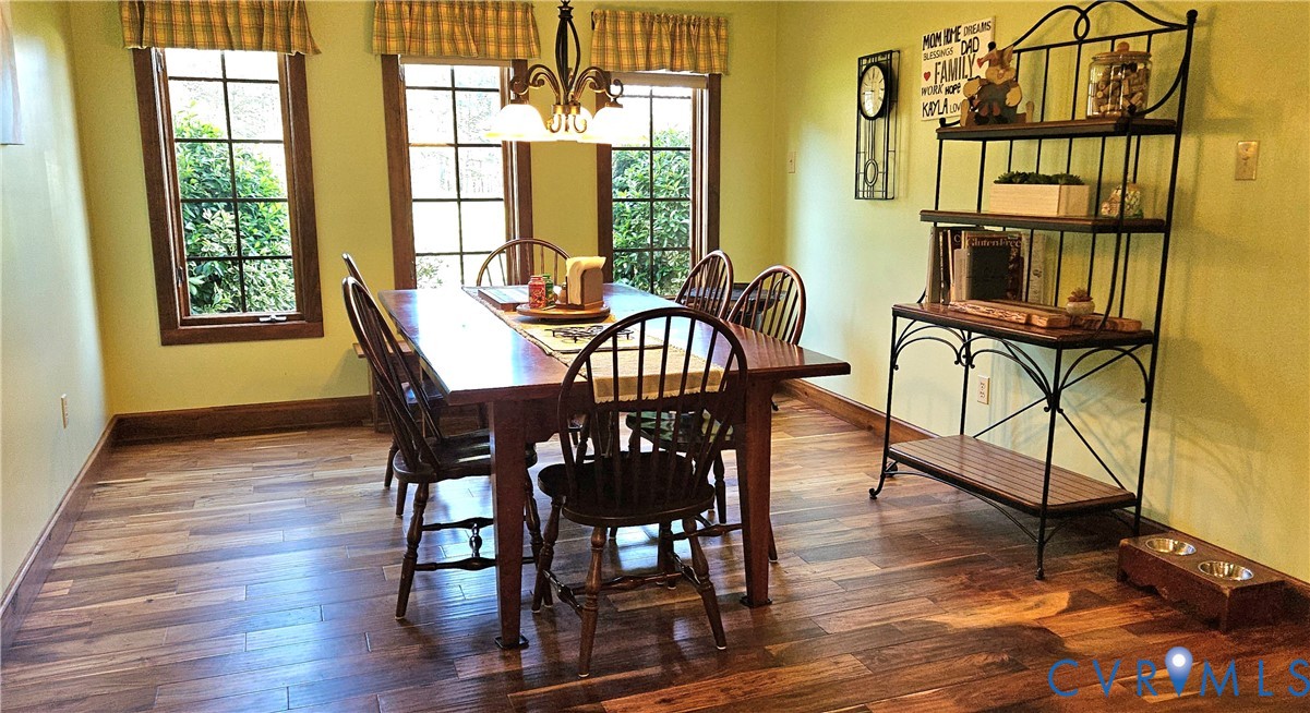10511 Ashcake Road Ashland, VA 23005 - Photo 23 of 58 a view of a dining room with furniture window and wooden floor