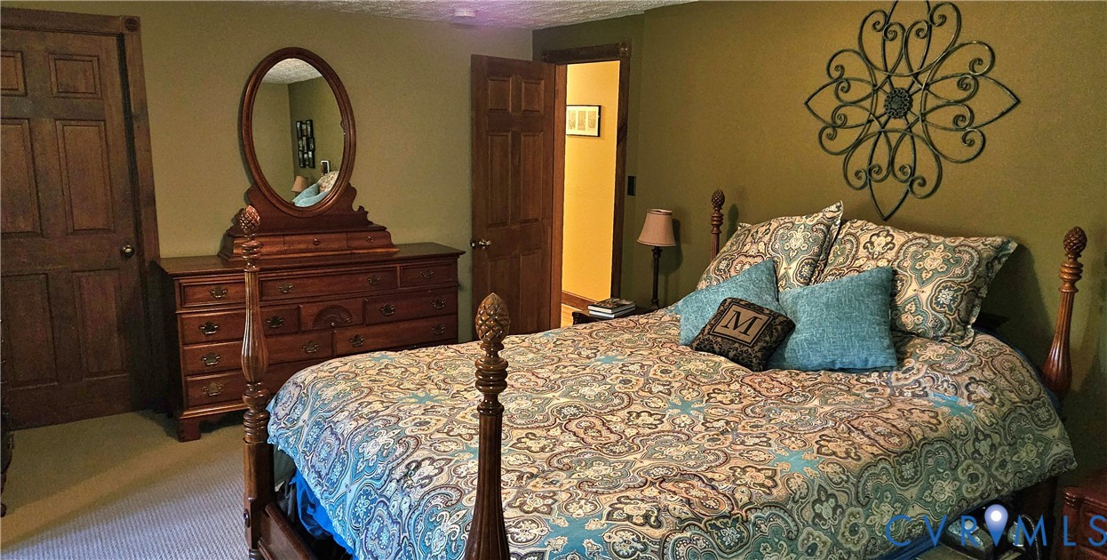 10511 Ashcake Road Ashland, VA 23005 - Photo 28 of 58 a bedroom with a bed and a dresser