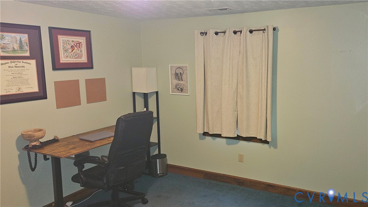 10511 Ashcake Road Ashland, VA 23005 - Photo 32 of 58 a view of a workspace with furniture and a window