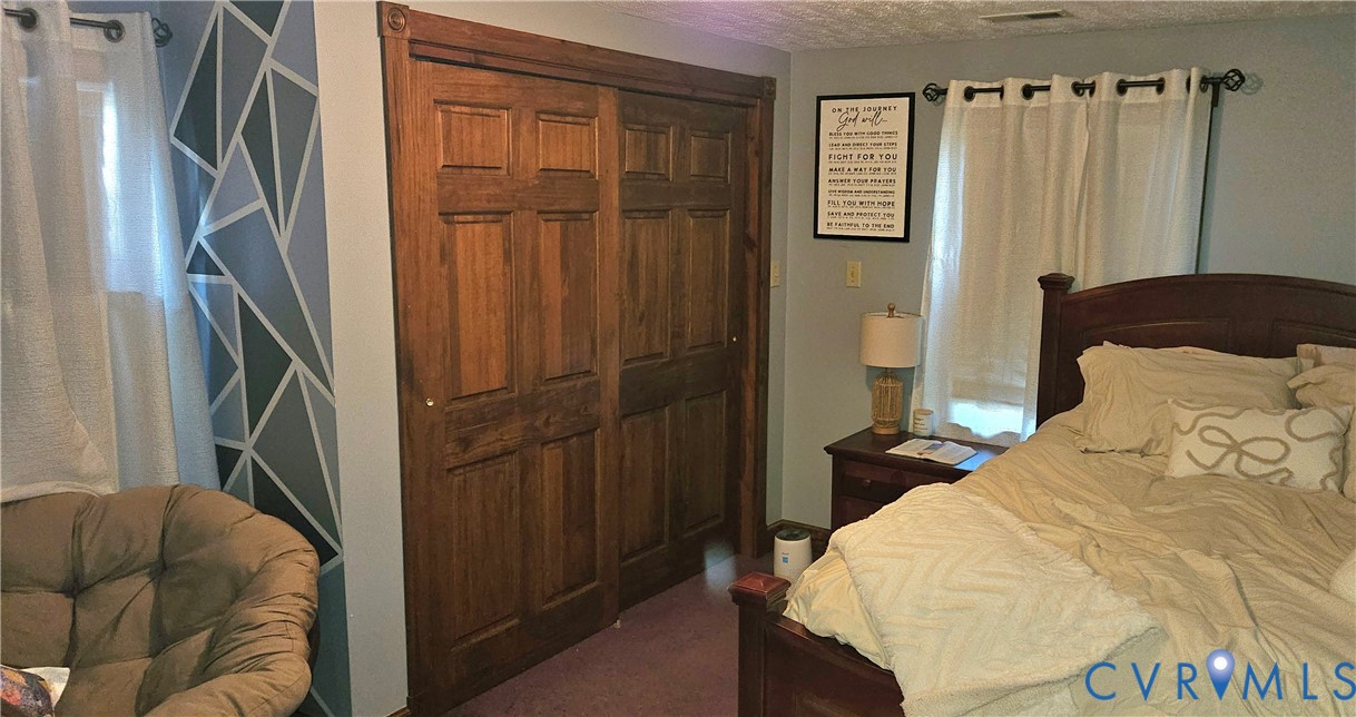 10511 Ashcake Road Ashland, VA 23005 - Photo 34 of 58 a bedroom with a bed and a closet