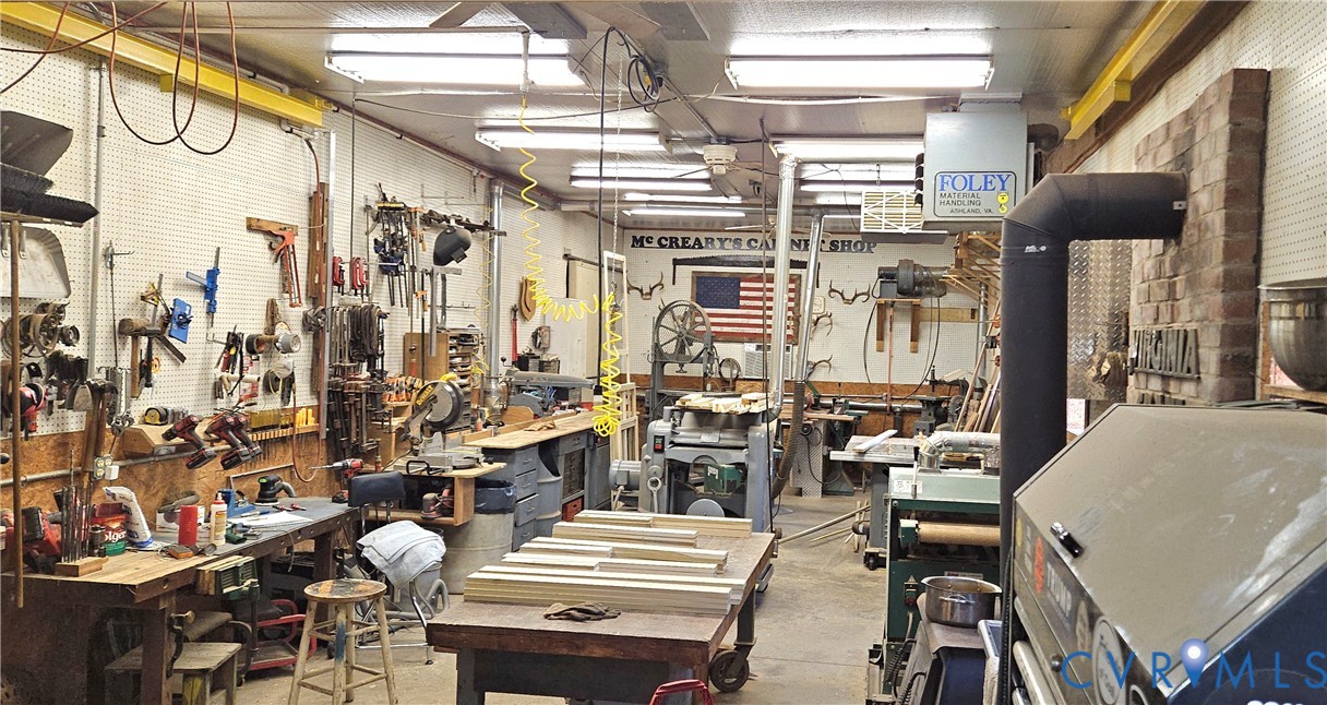 10511 Ashcake Road Ashland, VA 23005 - Photo 40 of 58 a living room with lots of furniture and a chandelier
