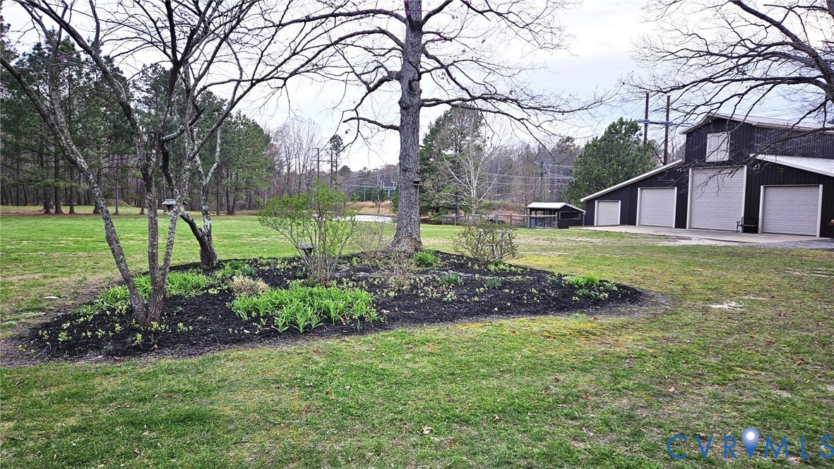 10511 Ashcake Road Ashland, VA 23005 - Photo 4 of 58 a view of a backyard with garden