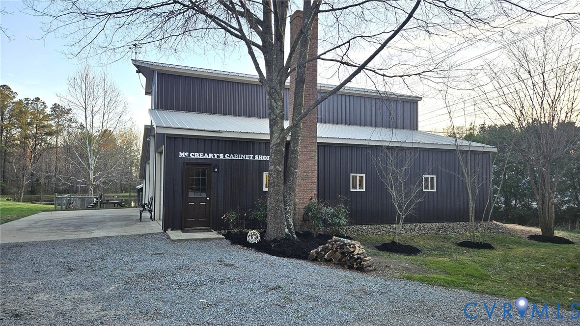 10511 Ashcake Road Ashland, VA 23005 - Photo 5 of 58 a front view of a house with garden