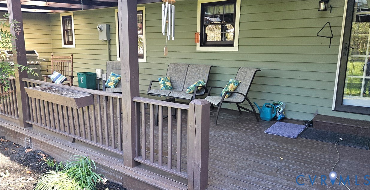10511 Ashcake Road Ashland, VA 23005 - Photo 55 of 58 a view of a deck with chair and wooden fence