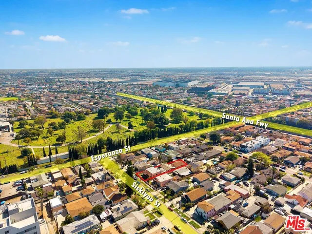 an aerial view of residential houses with outdoor space