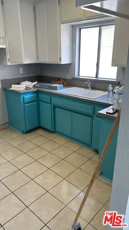 a room with a cabinets and window