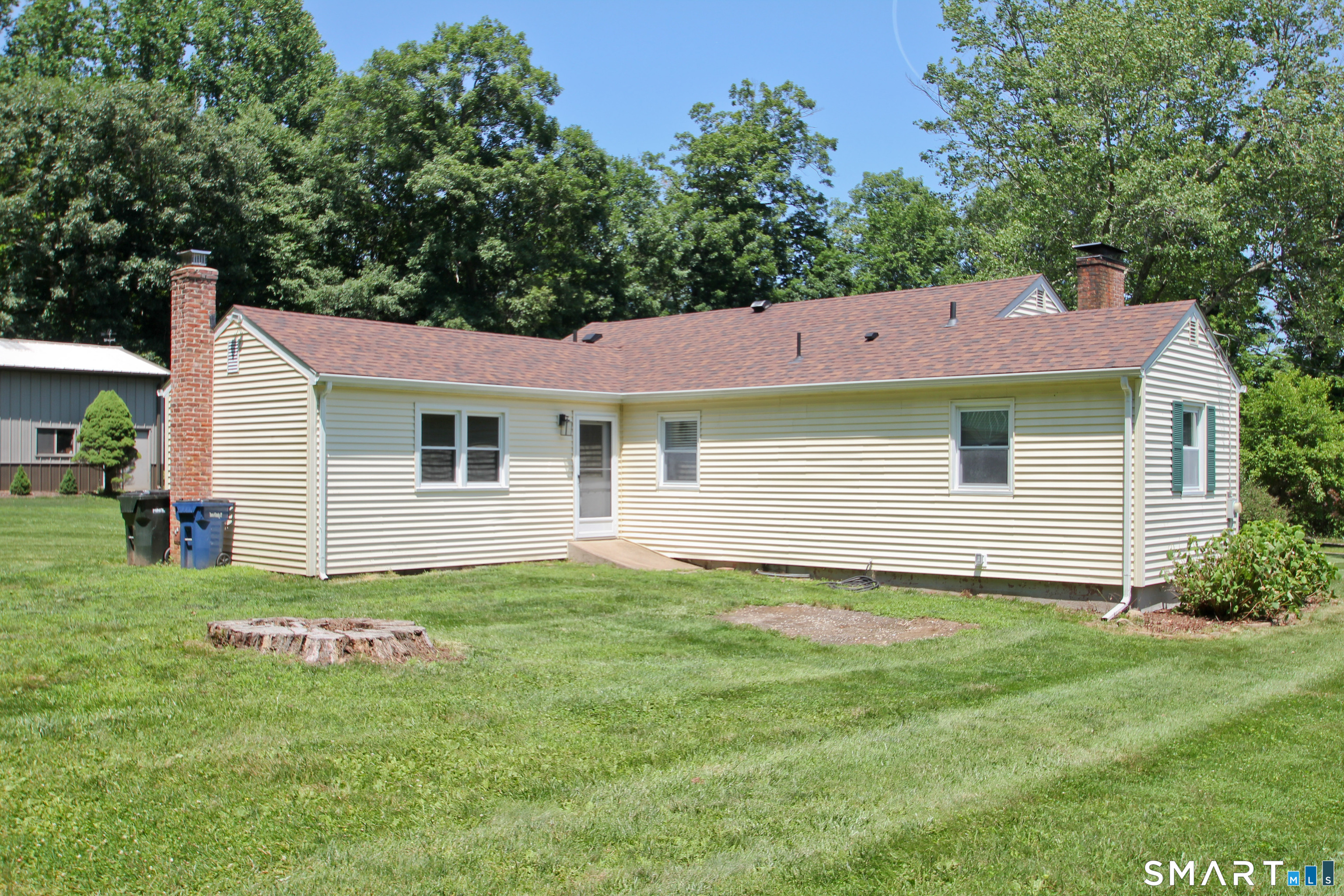 5 R Broad Hill Road Granby, CT 06090 - Photo 22 of 31 a view of a house with a yard