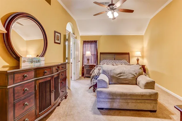 a bed room with a bed and a mirror