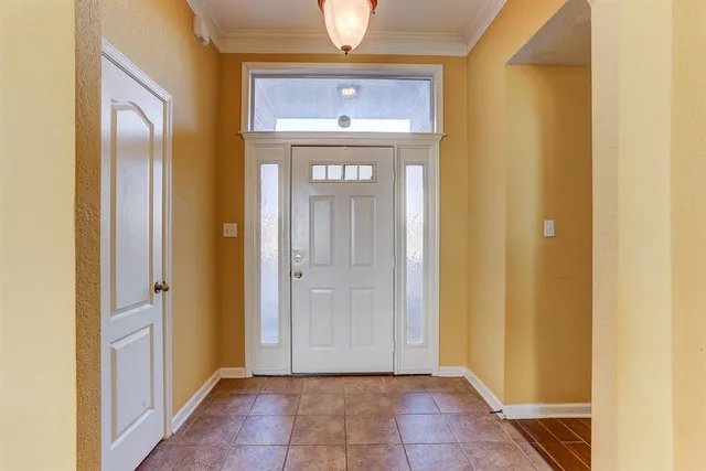 a view of a hallway with wooden door