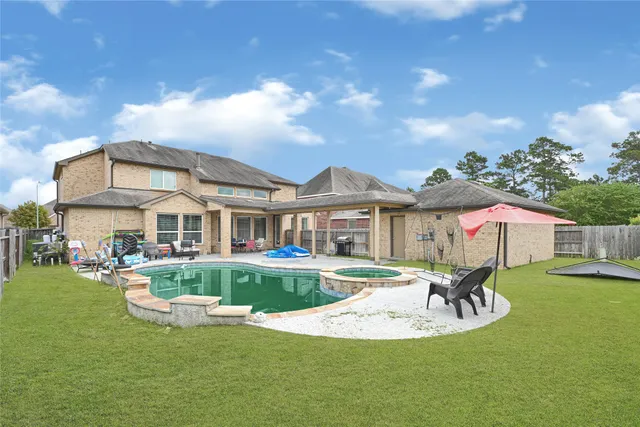 a view of a house with a yard porch and sitting area