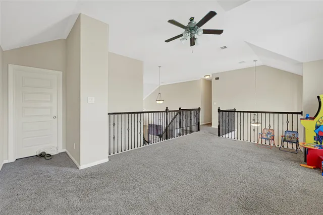 a view of a hallway with stairs