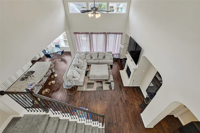 a view of living room with furniture and wooden floor