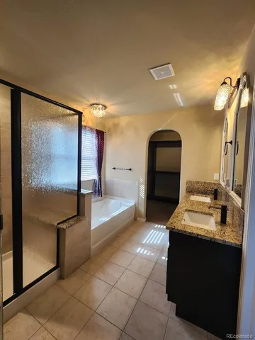 a view of living room with furniture and a mirror