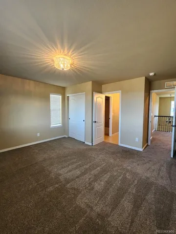 a view of an empty room and window