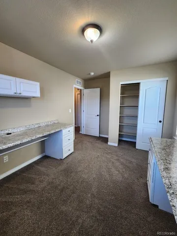 a kitchen with a stove and cabinets