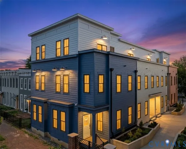 a view of a brick building with many windows