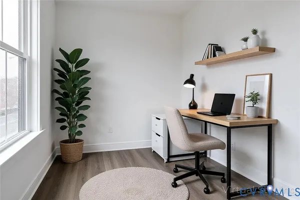 a bed room with a bed and a potted plant