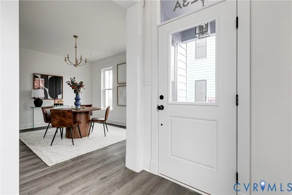 a view of a dining room with furniture and window