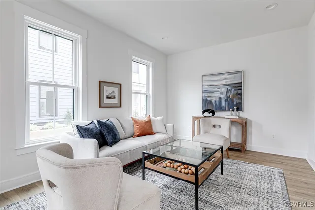 a view of a dining room with furniture window and wooden floor