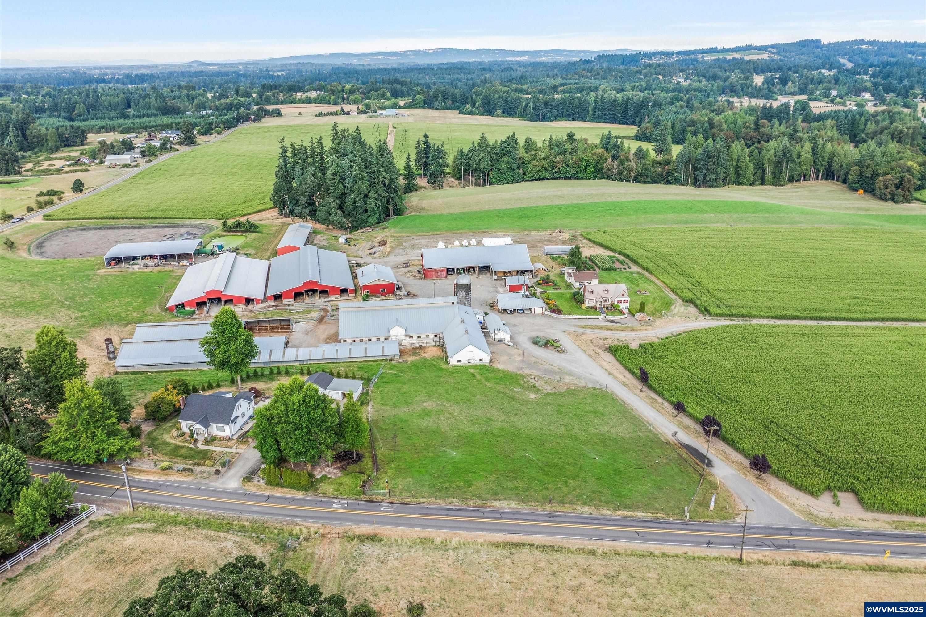 21303 South Central Point Road Canby, OR 97013 - Photo 5 of 50 an aerial view of a house with a garden and lake view