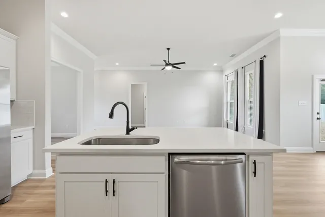 a kitchen with stainless steel appliances granite countertop a stove and a microwave