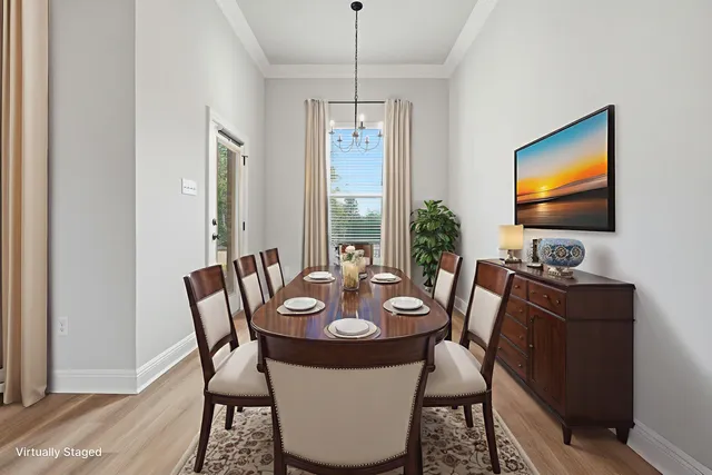 a living room with furniture a bookshelf and a potted plant