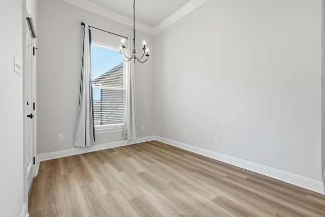 a view of room with window and hardwood floor