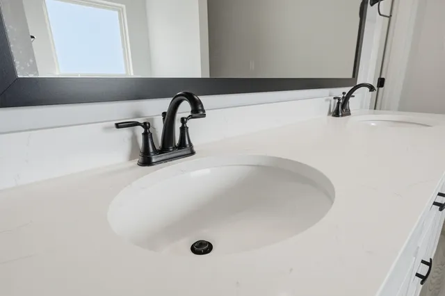 a view of empty room with wooden floor and ceiling fan