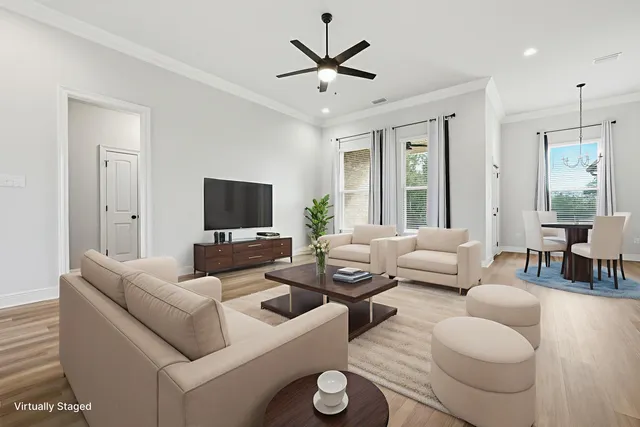 a living room with fireplace furniture and a flat screen tv