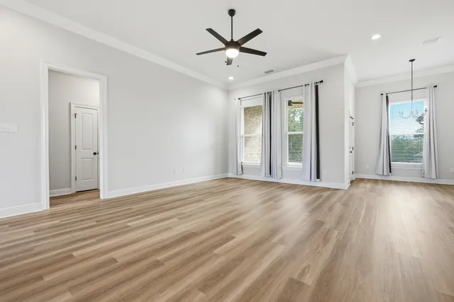 a view of a kitchen with a sink and a refrigerator