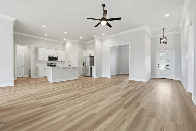 a metallic refrigerator freezer sitting in a kitchen