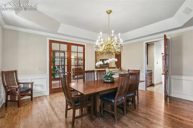 a kitchen with granite countertop lots of counter top space and wooden floor