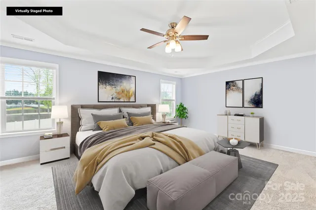 a bed sitting in a bedroom next to a window