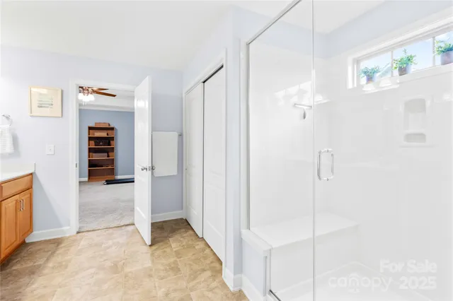 a living room with furniture a book shelf and a book shelf