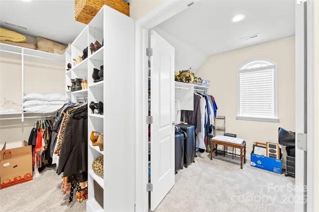 a view of yard with swimming pool and green space