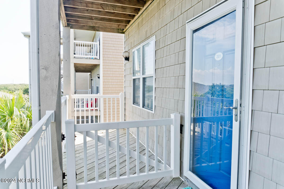 1701 Salter Path Road, Unit 201J Indian Beach, NC 28512 - Photo 32 of 54 Entrance & covered deck