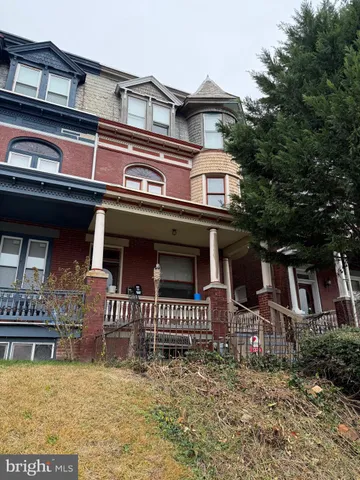 front view of a house with a small yard