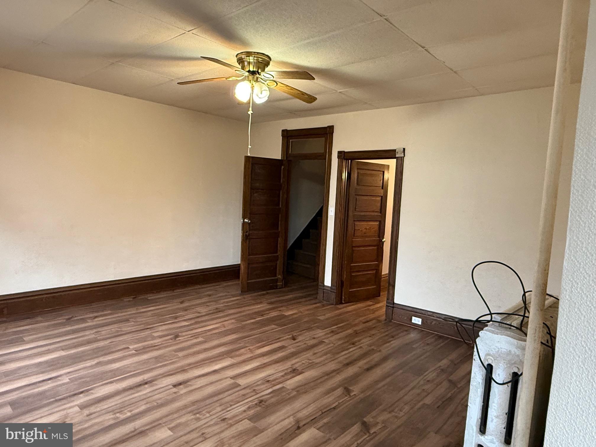 2329 North 3rd Street, Unit 2 Harrisburg, PA 17110 - Photo 10 of 17 a view of a room with wooden floor and ceiling fan